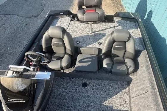 Slide: The Image of 2026 Tracker Pro Team 195 boat interior with seating and steering wheel. - 10