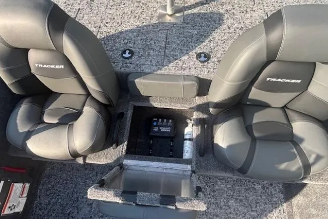 Slide: The Image of 2026 Tracker Pro Team 195 boat interior with gray seats and storage compartment. - 12