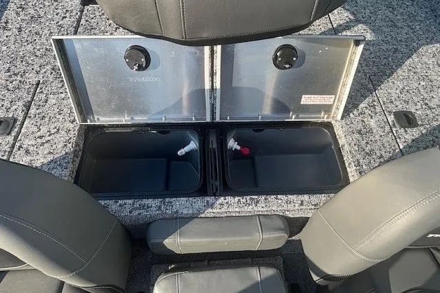 Slide: The Image of 2026 Tracker Pro Team 195 boat storage compartments with open lids and seating. - 13