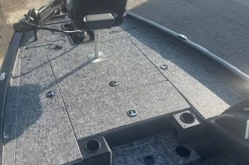 Slide: The Image of 2026 Tracker Pro Team 195 boat deck with seating and storage compartments. - 2