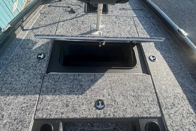 Slide: The Image of 2026 Tracker Pro Team 195 boat deck with open storage compartment. - 5