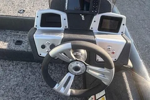 Slide: The Image of Steering console of 2026 Tracker Pro Team 195 boat with modern controls and displays. - 9