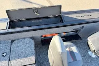 Slide: The Image of 2026 Tracker Targa V-18 Combo boat interior with open storage compartment and seating. - 7