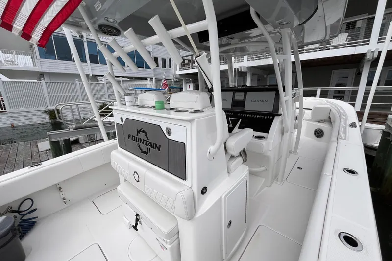 Slide: The Image of 2025 Fountain 34 CC boat interior with advanced Garmin navigation system. - 13