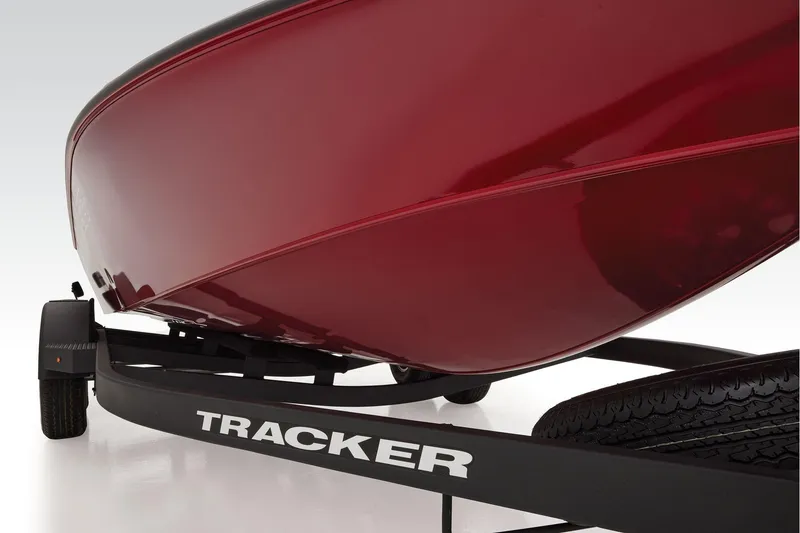 Slide: The Image of 2026 Tracker Savage 215 boat on trailer, parked outdoors near buildings. - 7