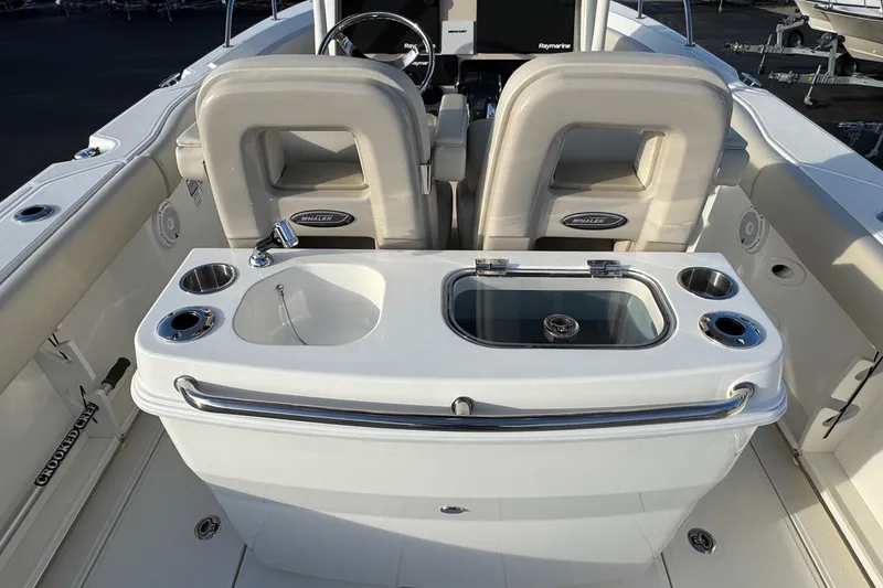 Slide: The Image of 2021 Boston Whaler 280 Outrage boat interior with seating and fishing station. - 16
