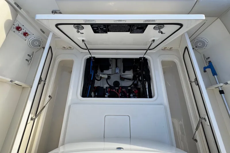 Slide: The Image of 2021 Boston Whaler 280 Outrage boat interior showing storage compartment and equipment. - 18