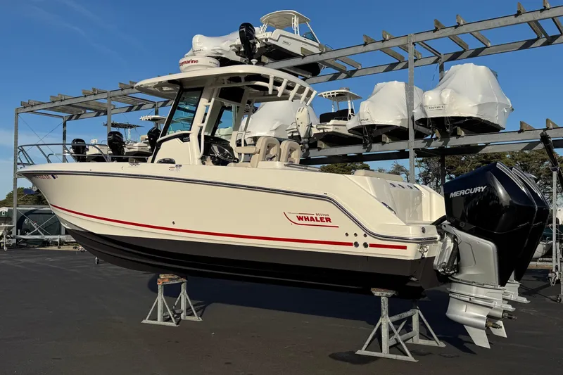 Slide: The Image of 2021 Boston Whaler 280 Outrage boat on display with Mercury engines. - 2