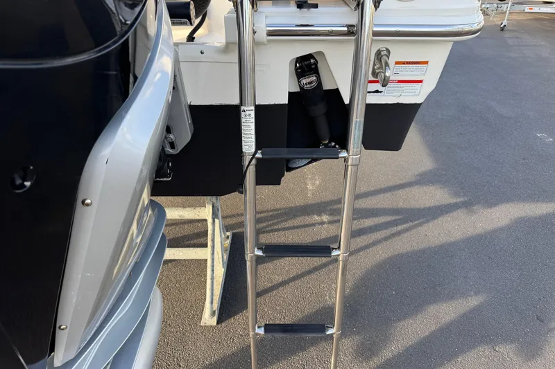 Slide: The Image of Stainless steel ladder on 2021 Boston Whaler 280 Outrage boat, rear view. - 21