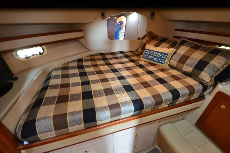 Slide: The Image of Luxurious cabin interior of 2001 Cruisers Yachts 3750 Motoryacht with plaid bedding. - 21