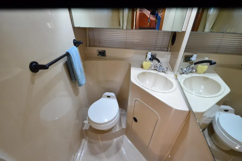 Slide: The Image of Bathroom interior of 2001 Cruisers Yachts 3750 Motoryacht with dual sinks and toilet. - 28