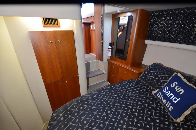 Slide: The Image of Interior of 2001 Cruisers Yachts 3750 Motoryacht with cozy bedroom and wooden cabinetry. - 34