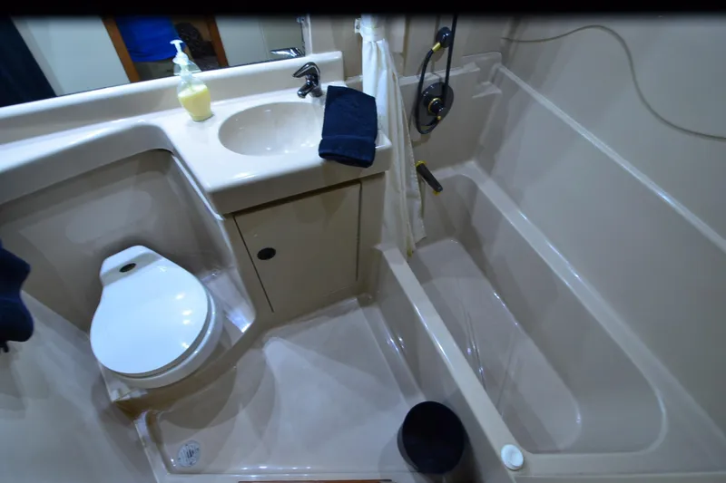 Slide: The Image of Bathroom interior of 2001 Cruisers Yachts 3750 Motoryacht with sink, toilet, and bathtub. - 35