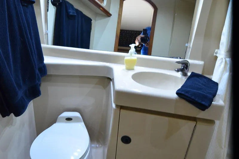 Slide: The Image of Bathroom interior of 2001 Cruisers Yachts 3750 Motoryacht with sink and toilet. - 37
