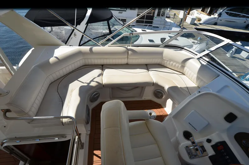 Slide: The Image of 2001 Cruisers Yachts 3750 Motoryacht cockpit with white seating and control panel. - 39