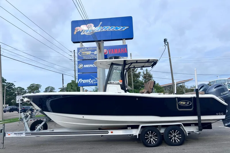 The Image of 2023 Sea Hunt Ultra 265 SE boat on trailer at dealership. - 0