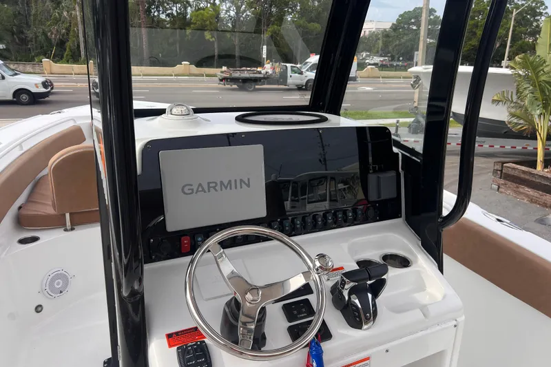 Slide: The Image of 2023 Sea Hunt Ultra 265 SE boat dashboard with Garmin navigation system. - 14