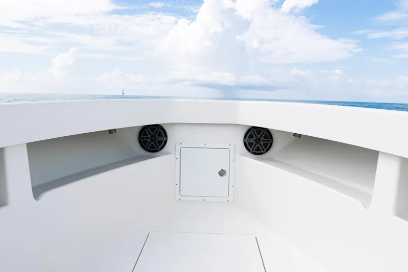 Slide: The Image of 2018 SeaVee 29 boat interior with speakers, ocean view, and clear sky. - 13