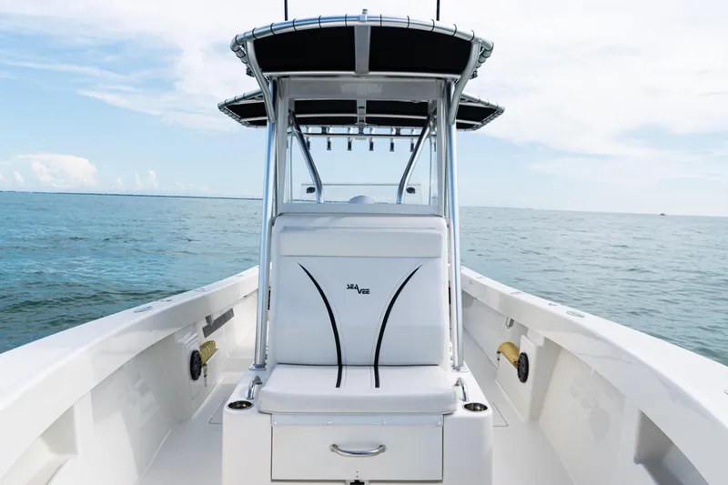 Slide: The Image of 2018 SeaVee 29 boat on open water, featuring sleek design and center console. - 16