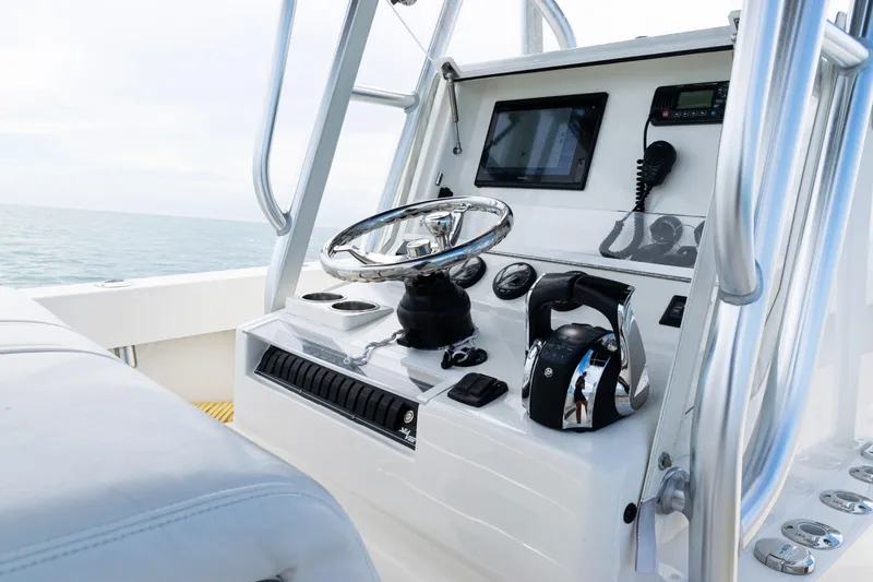 Slide: The Image of 2018 SeaVee 29 boat console with steering wheel and navigation equipment. - 20