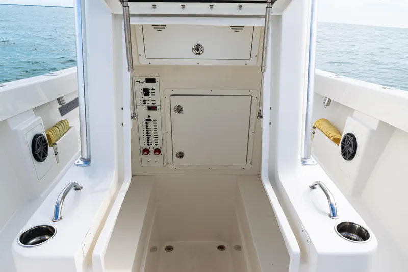 Slide: The Image of 2018 SeaVee 29 boat interior with control panel and storage compartments. - 23