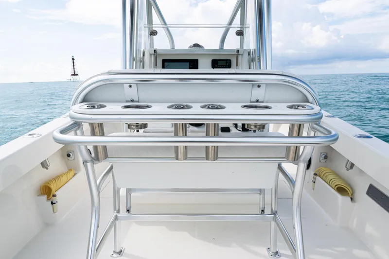 Slide: The Image of 2018 SeaVee 29 boat with rod holders, ocean view, and clear sky. - 25