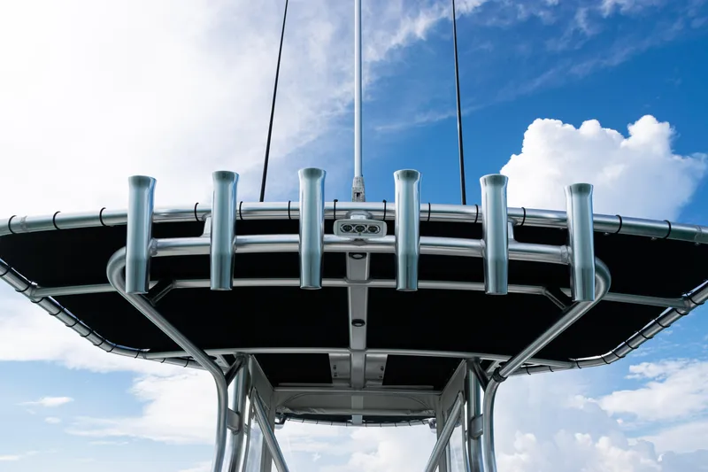 Slide: The Image of 2018 SeaVee 29 boat with rod holders against a blue sky background. - 27