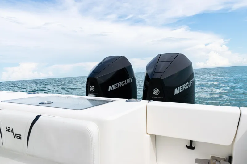 Slide: The Image of 2018 SeaVee 29 boat with twin Mercury engines on open water. - 28