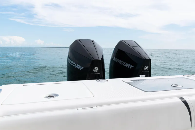 Slide: The Image of 2018 SeaVee 29 boat with twin Mercury outboard engines on open water. - 29