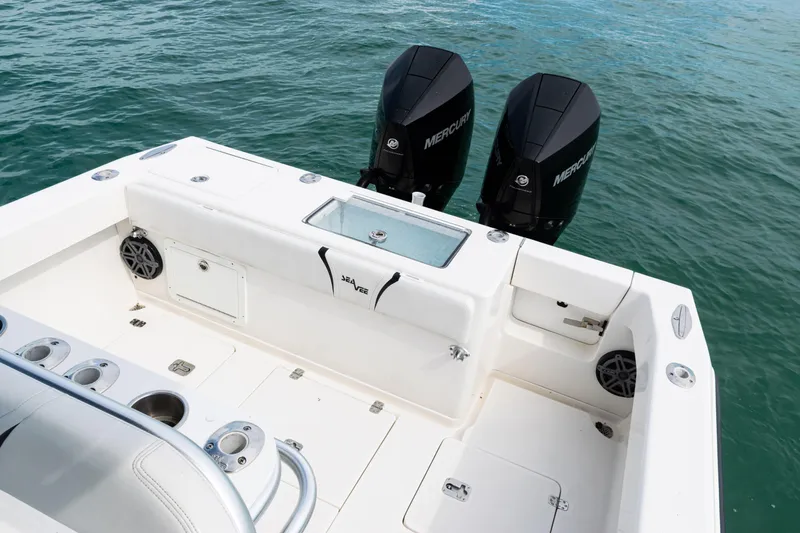 Slide: The Image of 2018 SeaVee 29 boat with twin Mercury engines on open water. - 30