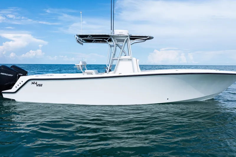 Slide: The Image of 2018 SeaVee 29 boat on calm ocean waters under a clear blue sky. - 35