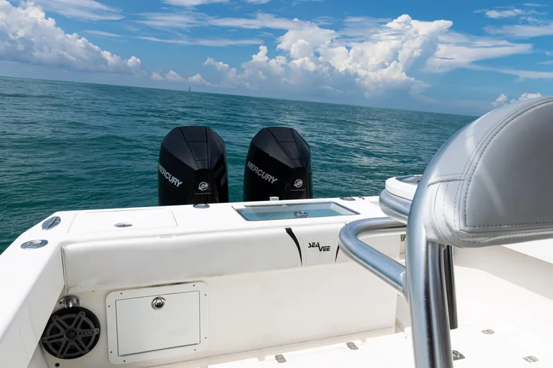 Slide: The Image of 2018 SeaVee 29 boat with dual Mercury engines on open ocean. - 36