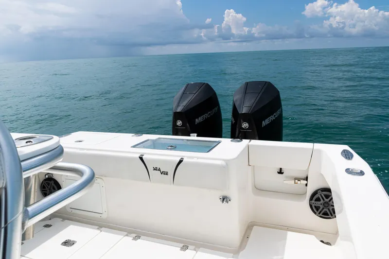 Slide: The Image of 2018 SeaVee 29 boat with dual Mercury engines on open ocean. - 37