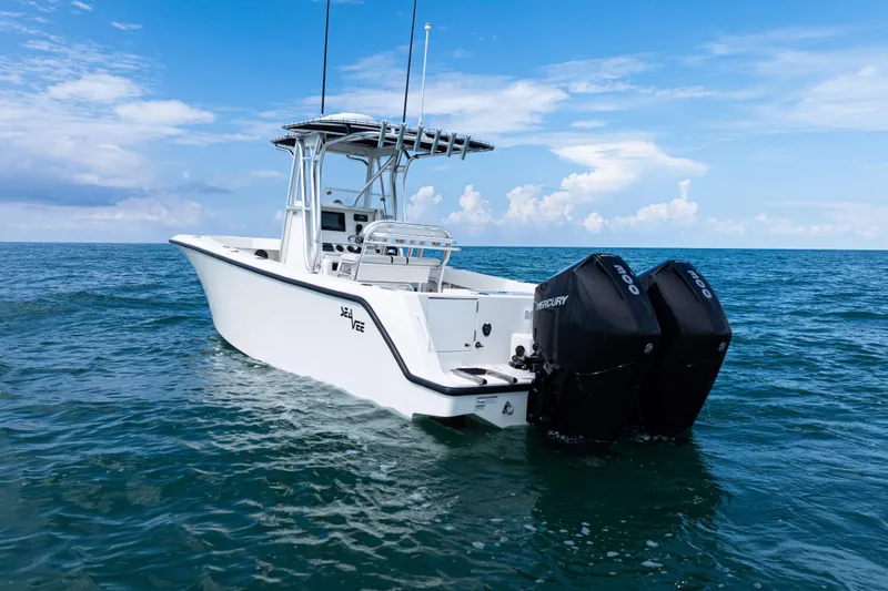 Slide: The Image of 2018 SeaVee 29 boat with dual Mercury engines on open ocean. - 38