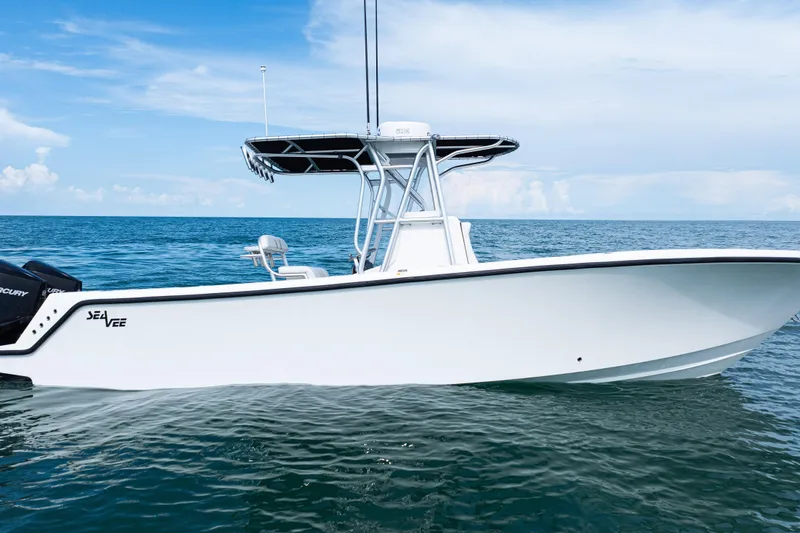 Slide: The Image of 2018 SeaVee 29 boat on calm ocean waters under a clear blue sky. - 40