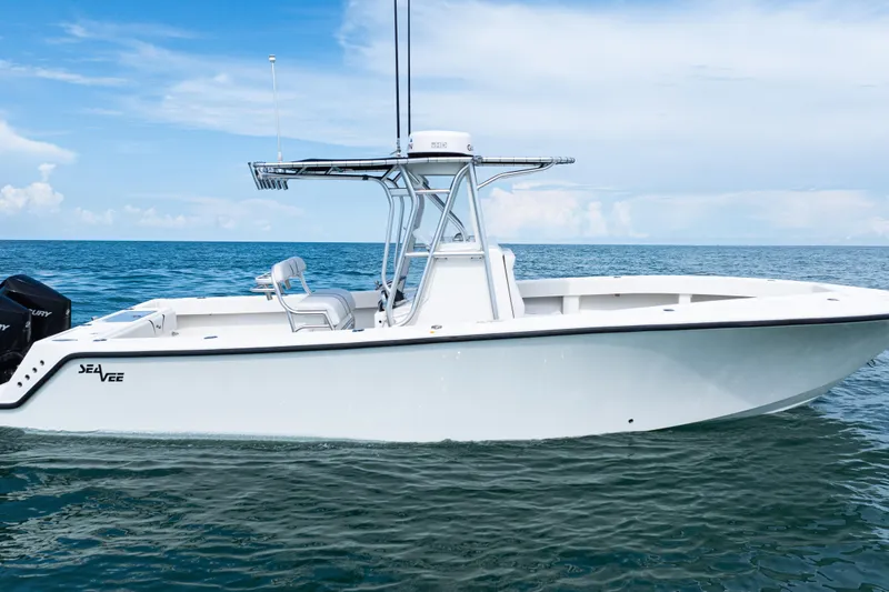 Slide: The Image of 2018 SeaVee 29 boat on calm ocean waters under a clear blue sky. - 41