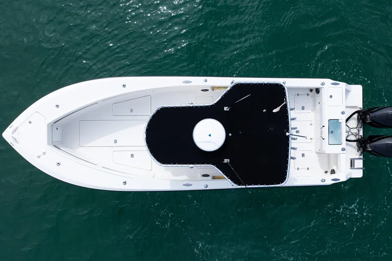 Slide: The Image of Overhead view of 2018 SeaVee 29 boat on water, showcasing sleek design and twin engines. - 43