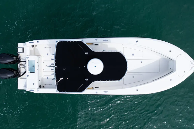 Slide: The Image of Overhead view of 2018 SeaVee 29 boat on water, featuring dual outboard motors. - 44