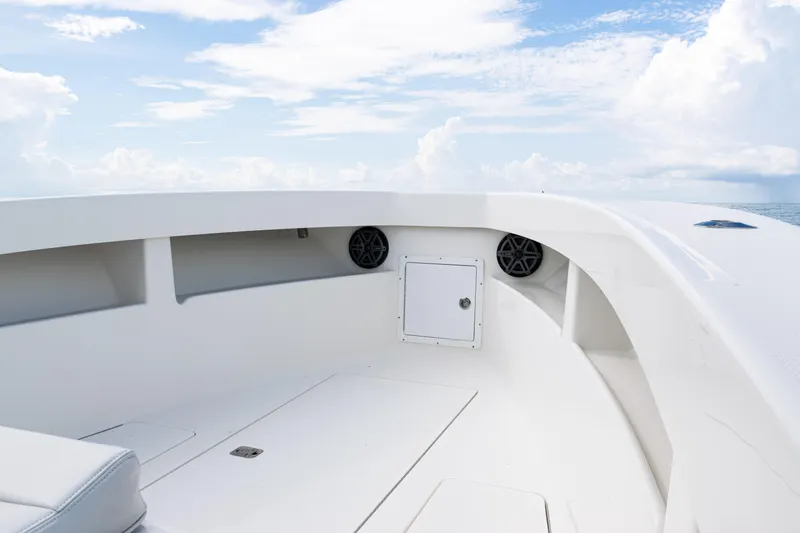 Slide: The Image of 2018 SeaVee 29 boat interior with speakers, storage, and ocean view. - 45