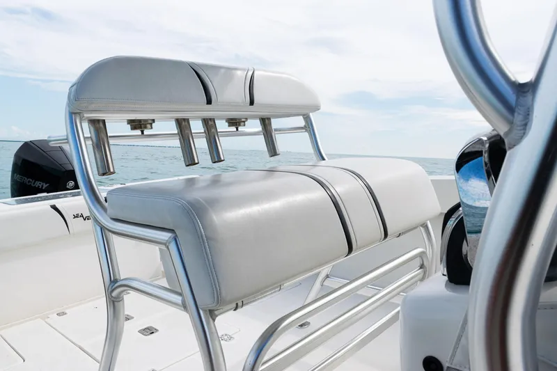 Slide: The Image of 2018 SeaVee 29 boat with sleek seating and rod holders on open water. - 48