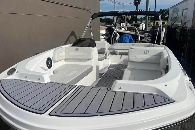 Slide: The Image of 2022 Hurricane SunDeck Sport 185 OB boat with spacious seating and sleek design. - 2