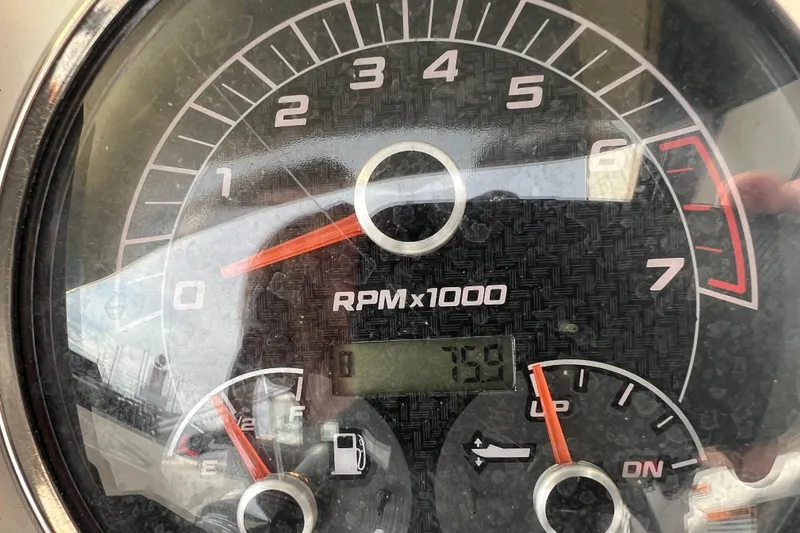 Slide: The Image of Tachometer of 2022 Hurricane SunDeck Sport 185 OB showing RPM and fuel gauge. - 9