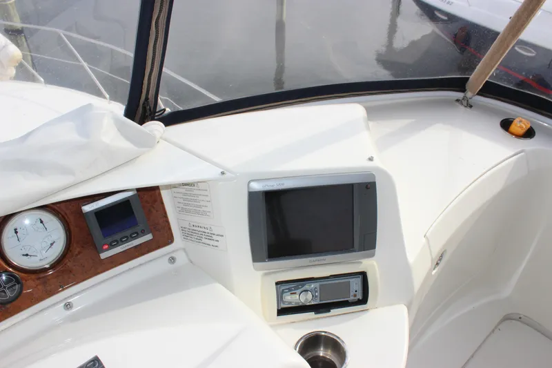 Slide: The Image of 2007 Silverton 36 Convertible boat dashboard with navigation and control instruments. - 12