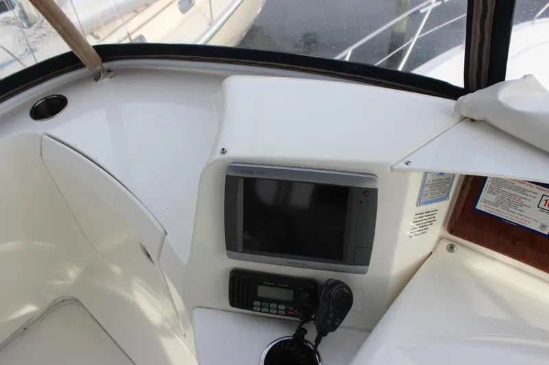 Slide: The Image of 2007 Silverton 36 Convertible boat cockpit with navigation equipment and radio. - 13