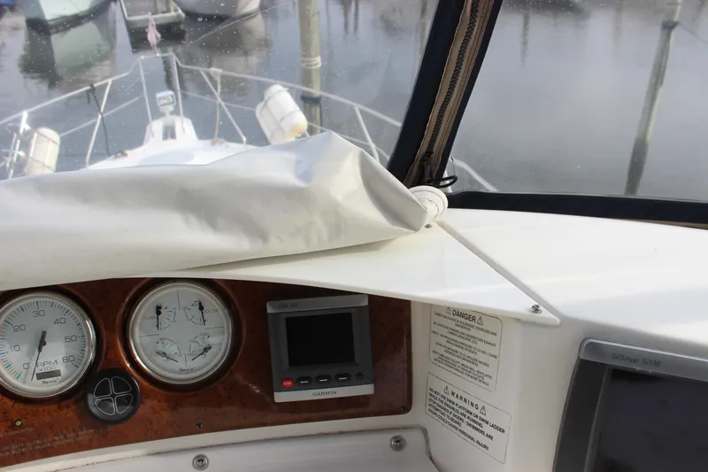 Slide: The Image of 2007 Silverton 36 Convertible boat dashboard with gauges and navigation equipment. - 14