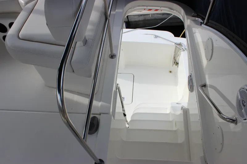 Slide: The Image of 2007 Silverton 36 Convertible yacht interior with white seating and stainless steel railings. - 15
