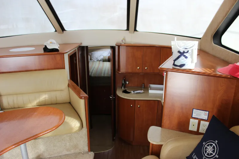 Slide: The Image of Interior of 2007 Silverton 36 Convertible yacht with wood cabinetry and seating. - 20