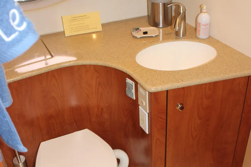 Slide: The Image of 2007 Silverton 36 Convertible bathroom with wooden cabinetry and modern sink. - 33