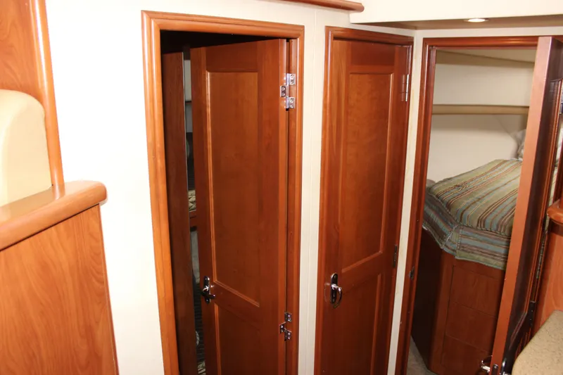 Slide: The Image of Interior of 2007 Silverton 36 Convertible yacht with wooden doors and cozy cabin. - 37