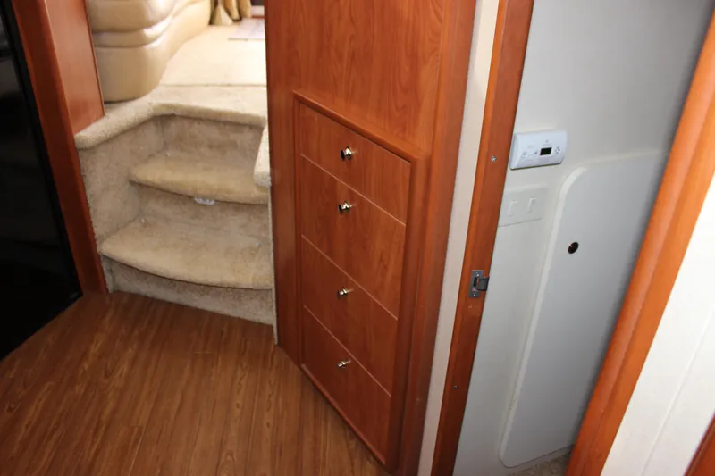 Slide: The Image of Interior of 2007 Silverton 36 Convertible with wooden cabinetry and carpeted stairs. - 38